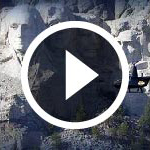 helicopter flying by mount Rushmore
